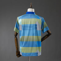 Polo Real Madrid Verde a Rayas 25/26 Adultos